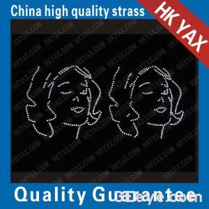 Two women with wavy hairstyles design motifs of rhine stone hot fix